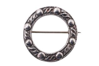 A Scottish silver brooch by Robert Allison, being an annulus with cast Celtic decoration, Glasgow,