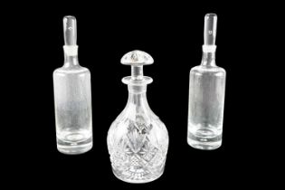 A Corbett & Webb decanter together with a pair of Dartington style cylinder decanters