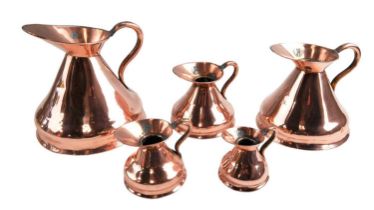 A set of five Victorian / early 20th Century graduated copper measures, one Gill to one Quart