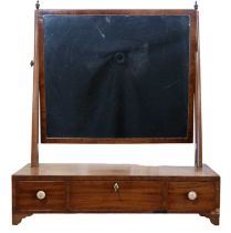 A Georgian mahogany dressing table / swivel toilet mirror, having a long and two short drawers to