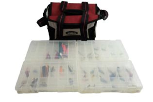A Flambeau Osprey fishing tackle bag together with a quantity of spinners, etc