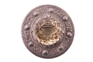 A Scottish silver plaid brooch by Robert Allison, having a 19 mm citrine set on an annulus of Celtic