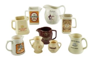 A group of ceramic whisky and similar advertising jugs, including Highland Queen, The Glenlivet,