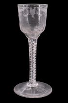 A mid 18th Century opaque twist stemmed wine glass, its fluted ogee bowl decorated with wheel-cut