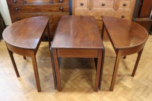 A George III mahogany double D-ended dining table, having tulipwood crossbanding and boxwood