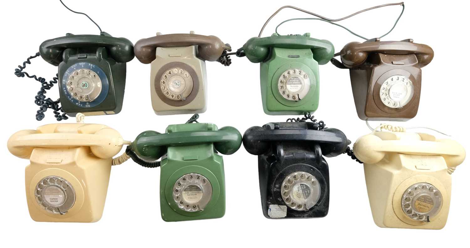 Eight 700 series rotary dial telephones, models 706 L, 706 F, 746 GNA and 746 GEN