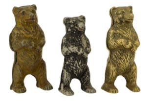 Three novelty 'standing bear' moneyboxes, after the original cast iron moneybox by John Harper & Co,