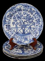 A set of four Kangxi Chinese export blue-and-white porcelain plates, each decorated in depiction