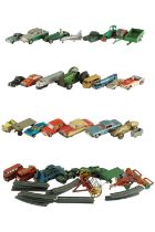 A group of vintage play-worn diecast and other toy cars, trains, boats and aeroplanes, including a