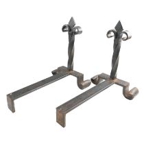 A pair of late 20th Century wrought iron fire dogs / andirons, each having a twisted stem with a