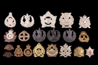 A quantity of Dominions / Commonwealth cap badges etc