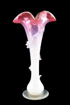A late 19th / early 20th Century cranberry vaseline glass floral trumpet vase, decorated with a