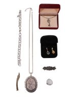 A quantity of silver and white metal jewellery, including a floral engraved and embossed locket, a