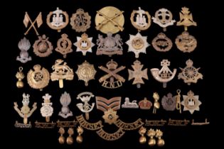 A small collection of British army cap and other badges including Army Cyclist Corps and Tank