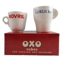 A 1950s printed tinplate OXO Cubes box together with Bovril and Horlicks mugs by Arklow of