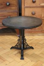 A late 20th Century occasional table, having a wrought iron base and a diecast top, 51 x 46 cm