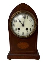 An Edwardian mahogany lancet top mantle clock, having a brass drum movement, the case decorated with