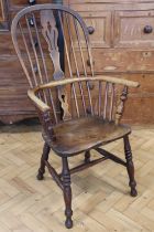 A late 19th / early 20th Century Windsor arm chair, 109 cm