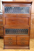 A George VI mahogany and leaded glass Globe Wernicke lawyer's bookcase, having a secretaire and four