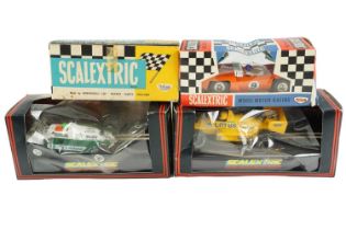 A quantity of vintage and later Scalextric slot cars including two vintage boxed Triang Model