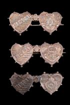 Three early 20th Century silver Mizpah type sweetheart brooches; respectively Worcestershire