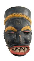 An African carved and painted wooden mask