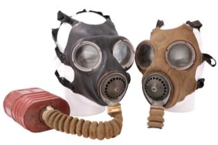A Second World War British military gas mask together with the mask from another