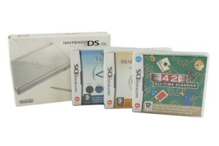 A Nintendo DS Lite together with three games
