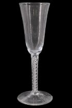 A mid 18th Century opaque twist stemmed ale glass, the bowl of typical form, its stem having