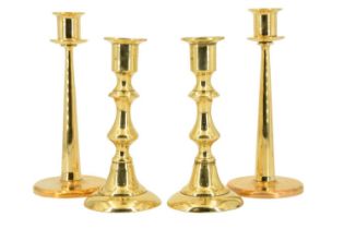 A pair of Victorian brass candlesticks together with a pair of 20th Century machined brass sticks,