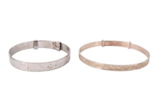 A 1970s silver christening bangle together with a white-metal example, latter marked "silver",