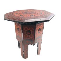 A Burmese small octagonal lacquered folding table or stand, exhibiting Persian influence and