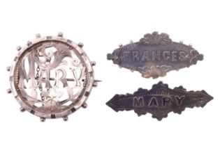 Three Victorian and Edwardian name brooches, comprising a white metal brooch 'Frances' and two