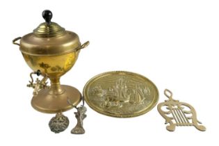 Sundry items of brass including a lion's mask and one other door knocker, a lyre form trivet, a