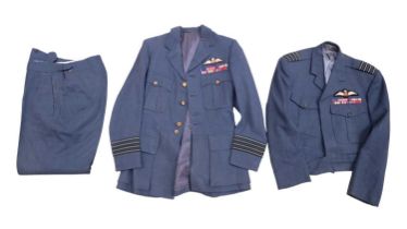 An early post-War RAF group captain's uniform group, comprising two tunics each bearing pilot's