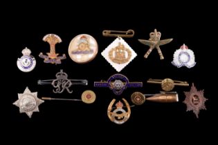A small collection of military sweetheart brooches etc including a tie-clip and two stick pins