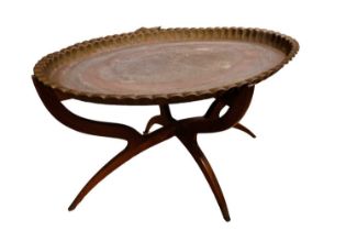 A mid 20th Century Indian brass topped hardwood folding coffee table, 85 x 64 x 54 cm