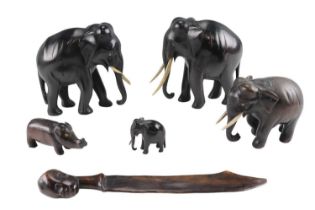 Four African carved elephants, a paper knife etc