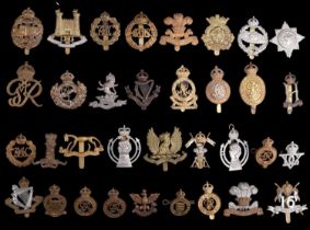 A collection of cavalry and yeomanry cap and other badges