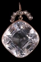 A Victorian diamond and rock crystal pendant, comprising a large colourless rock crystal of