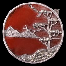 A Japanese circular agate and marcasite brooch, being a marcasite white metal openwork stylized view