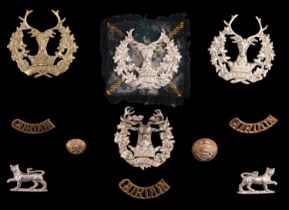 A group of Gordon Highlanders cap and other badges and insignia