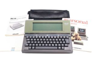 A 1980s cased Olivetti M10 Portable Computer with instructions, 31 cm x 23 cm