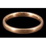 A George V 18 ct gold wedding band, of D-section, rubbed assay marks, Birmingham, 1928, 2.69 g, size