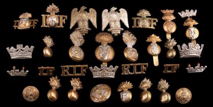 A group of Royal Irish Fusiliers cap and other badges and insignia