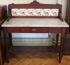 A Victorian mahogany marble top washstand, having a transfer decorated tile back, 107 x 50 x 109 cm