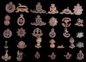 A collection of British army officers' Service Dress cap and collar badges