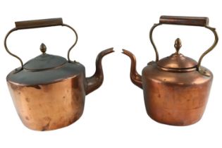 A Victorian copper kettle together with another similar kettle, larger 28 cm
