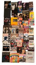A large quantity of publications pertaining to The Beatles, John Lennon, Paul Mccartney, etc