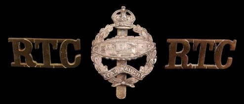An inter-War Royal Tank Corps cap badge (right-facing tank) and shoulder titles